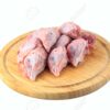 raw chicken heads on a white background on a wooden board